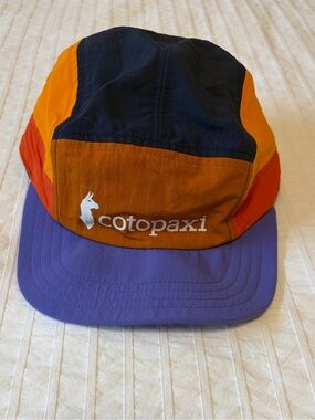 COTOPAXI- Tech 5-Panel Hat in the limited-edition Mezcal / Amethyst colorway.